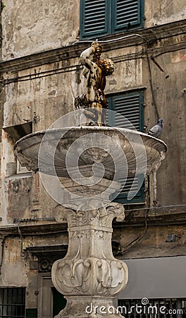 Antique / ancient roman style fountain in Genoa, Italy Stock Photo