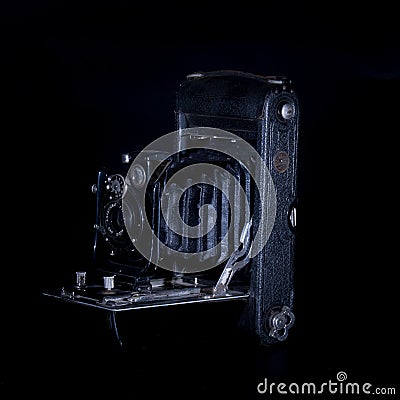 Antique bellows camera in moody light Stock Photo