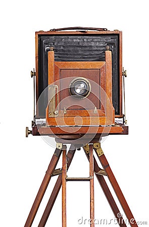 Antique bellows style camera front view close up on an old tripod isolated on white Stock Photo