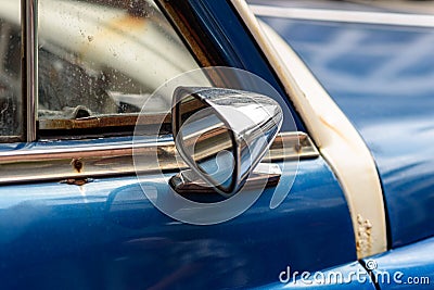 Antique blue car exterior rear-view mirror Stock Photo