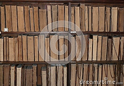 Antique books chained to the bookshelves Editorial Stock Photo