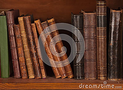 Antique books on shelf Stock Photo