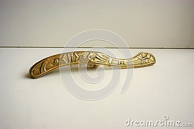 Brass brush and dustpan with art nouveau decoration. Stock Photo