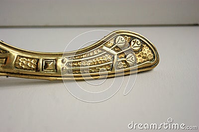 Brass brush and dustpan with art nouveau decoration. Stock Photo