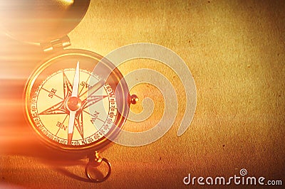 Antique brass compass over old background Stock Photo