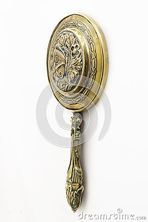 Antique brass hand-mirror Stock Photo