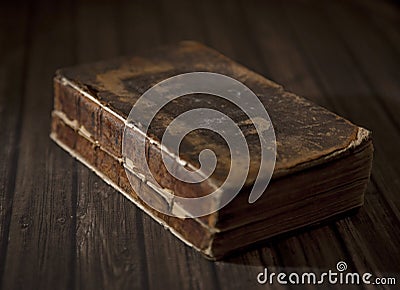 An Antique Broken Book on a Table Stock Photo