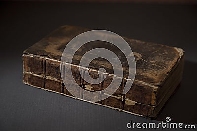 An Antique Broken Book on a Table Stock Photo