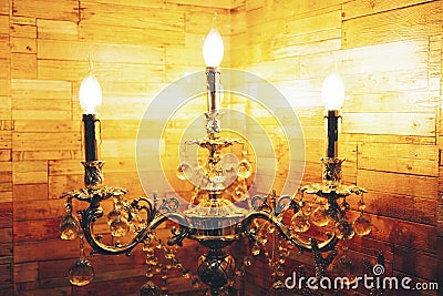 Antique candelabra with three melting candles Stock Photo