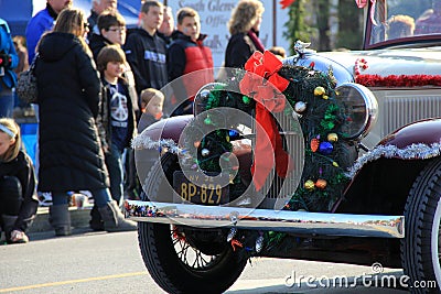 Antique car driving through the Annual Holiday Parade,Glens Falls New York,2014 Editorial Stock Photo