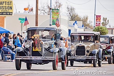 Antique car driving in Cowboy Christmas Parade Editorial Stock Photo