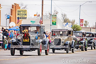 Antique car driving in Cowboy Christmas Parade Editorial Stock Photo