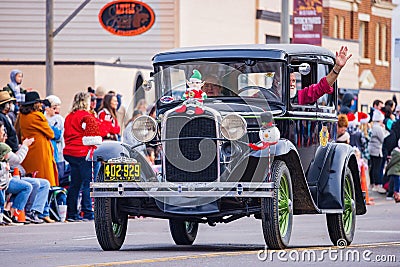 Antique car driving in Cowboy Christmas Parade Editorial Stock Photo