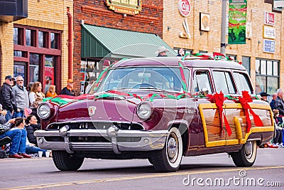 Antique car driving in Cowboy Christmas Parade Editorial Stock Photo