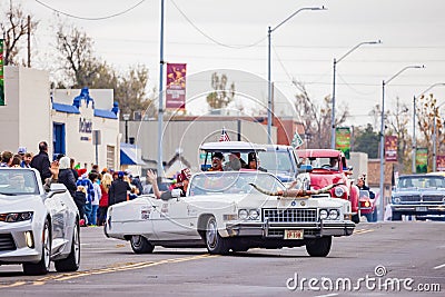 Antique car driving in Cowboy Christmas Parade Editorial Stock Photo