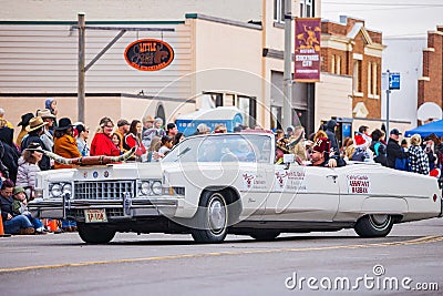 Antique car driving in Cowboy Christmas Parade Editorial Stock Photo