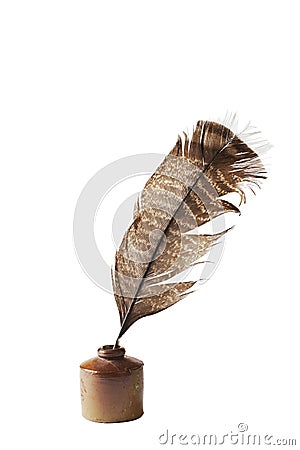 Antique ceramic ink well and feather quill pen Stock Photo