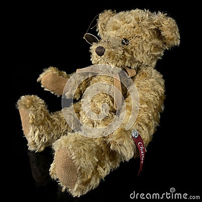 Vintage teddy bear toy on isolated black background Editorial Stock Photo