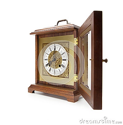 Antique clock with lid open, on white. Stock Photo