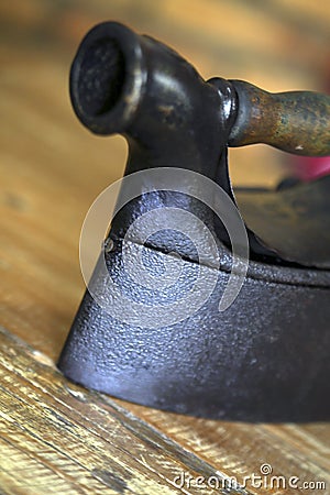 Antique coal iron on wood table Stock Photo