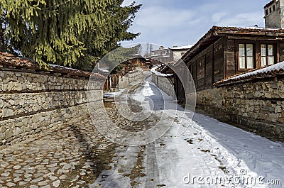 Antique cobblestone street with beauty ancient houses, town Koprivshtitsa Stock Photo