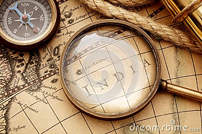 Antique compass, magnifier spyglass on map Stock Photo