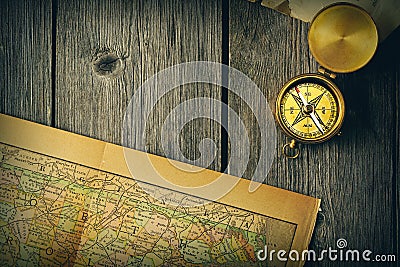 Antique compass over old map Stock Photo