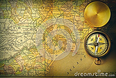 Antique compass over old XIX century map Stock Photo