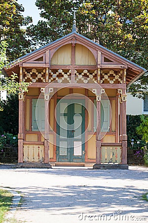 Antique decorated wooden garden hut Stock Photo