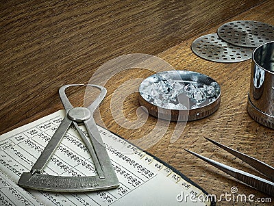 Antique Diamond Tools with Loose Diamonds on Wooden Background Stock Photo