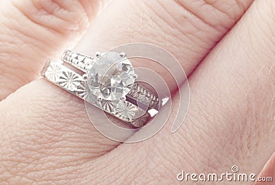 Antique Diamond Wedding Ring and Band on Finger Stock Photo