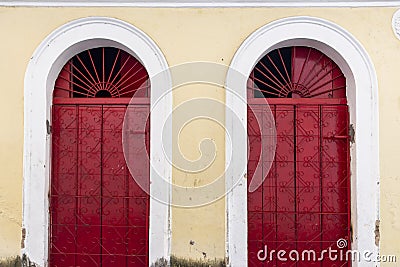 Antique door details in color with shadow, iron, cement, wood Stock Photo