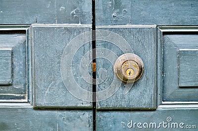 Antique door knob on a vintage wooden door Stock Photo
