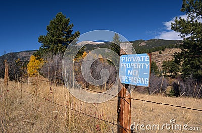 Antique Faded Blue Private Property No Trespassing Sign Stock Photo