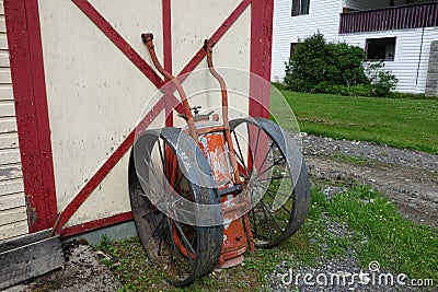 An antique fire extinguisher with wheels. Stock Photo