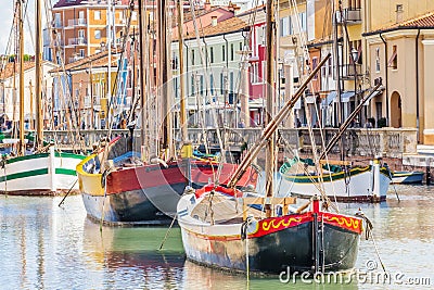 Antique fishing boats in harbor channel Stock Photo