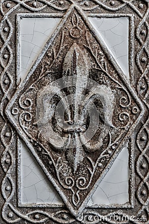 Antique Fleur-de-lis on Tile Stock Photo