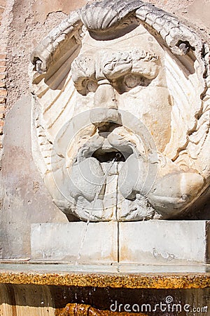 An antique fountain in Rome Stock Photo