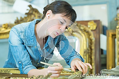 Antique frame collector cleaning embellishment Stock Photo