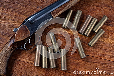 Antique 16-gauge break-action smooth-bored shotgun with cartridges Stock Photo