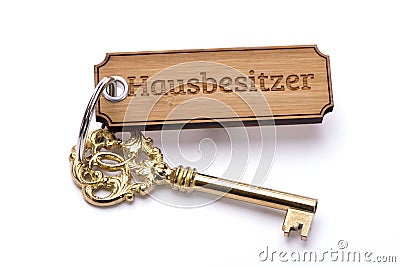 Antique golden house key on keyring Stock Photo