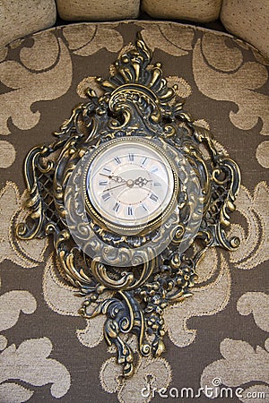 Antique goldish clock. Stock Photo
