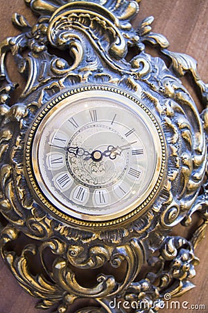 Antique goldish clock. Stock Photo