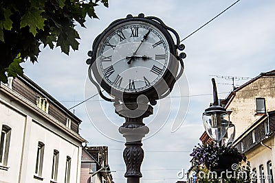 Antique grandfather clock in pedestrian zone Stock Photo