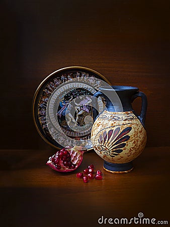 Antique Greek vase, plate and pomegranate Editorial Stock Photo