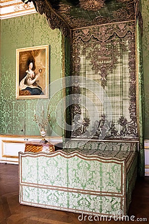 Antique green canopy bed in a stately interior Editorial Stock Photo