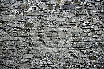 Antique grunge old gray stone wall masonry Stock Photo