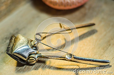 Antique hair clipper on wooden background Stock Photo