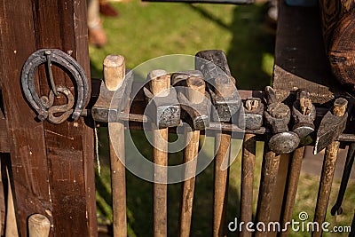 8 antique hammers of various shapes and horseshoe Stock Photo