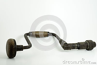 Antique hand drill isolated Stock Photo